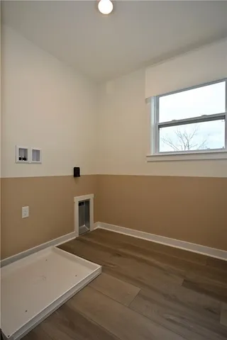a view of an empty room with glass door and balcony