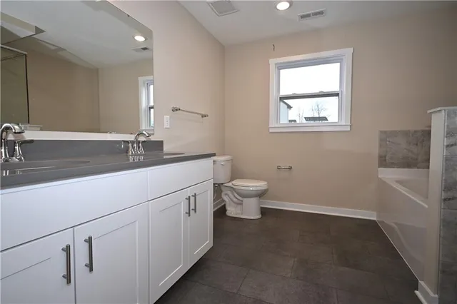 a bathroom with a bath tub