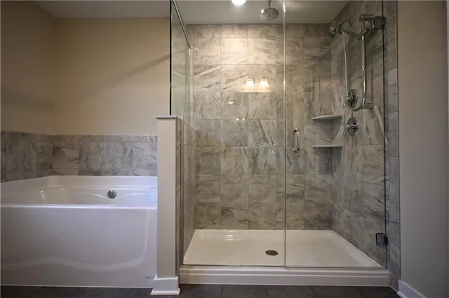 a bathroom with a toilet and shower