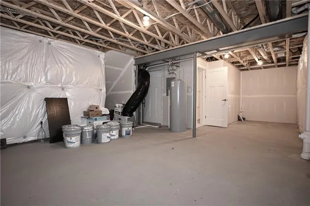 a view of walk in closet with clothes