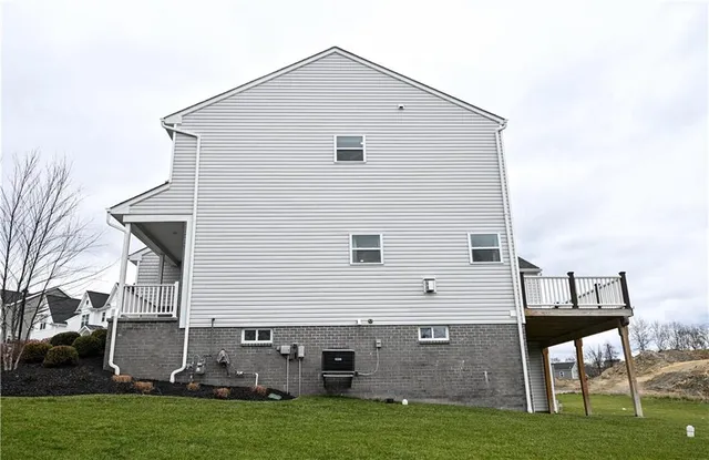 a view of a house with a backyard