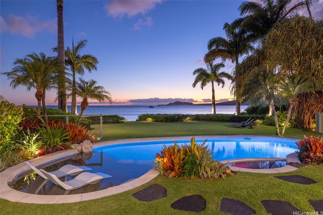 a view of a lake with houses in the back