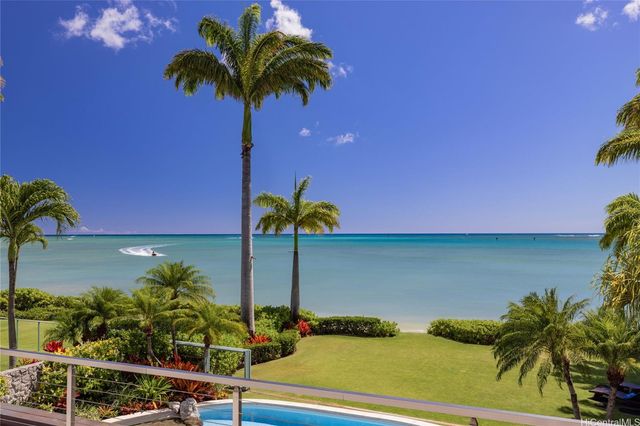 a vase of flowers sitting on a table with a potted plants