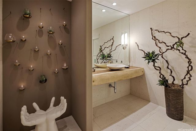 a bathroom with a sink and mirror