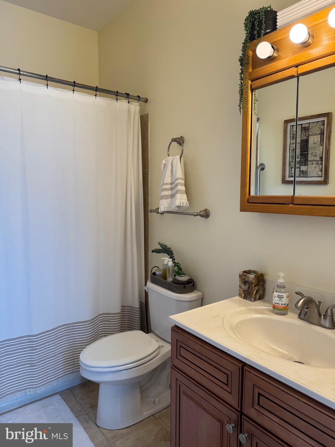 1 Kings Court, Unit 5 Haddonfield, NJ 08033 - Photo 7 of 15 a bathroom with a sink and a toilet