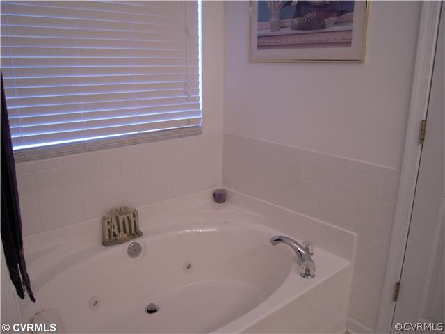 14713 Clover Ridge Lane Chesterfield, VA 23832 - Photo 8 of 10 a bathroom with a bathtub