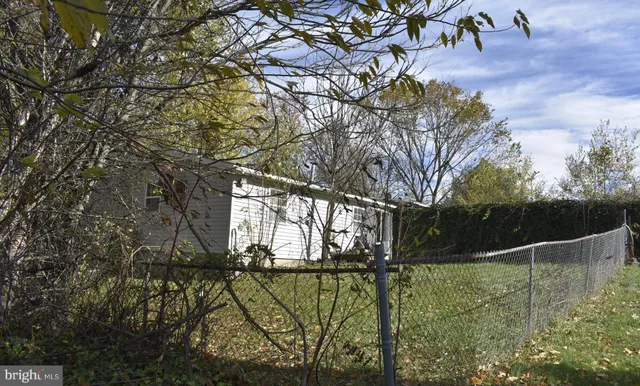 a view of swimming pool with a yard
