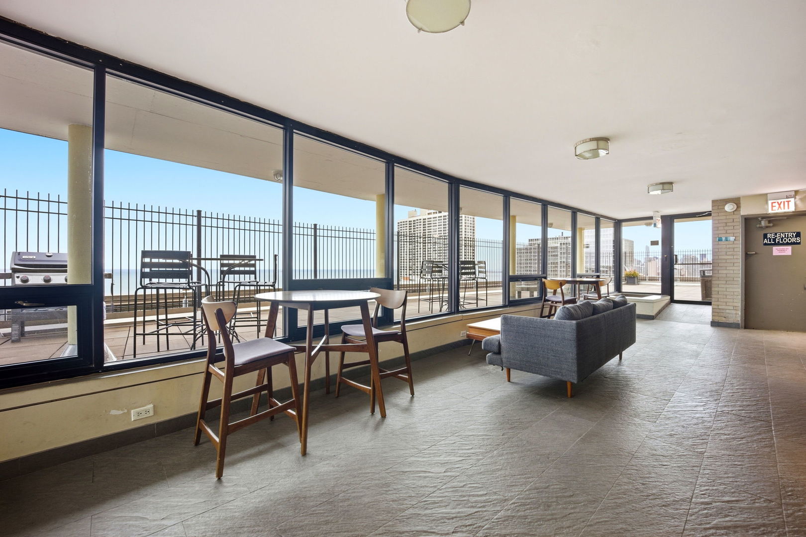 2930 North Sheridan Road, Unit 1912 Chicago, IL 60657 - Photo 19 of 25 a living room with furniture and a large window