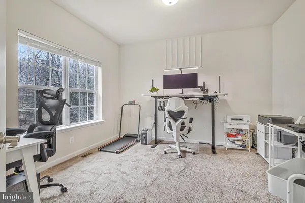 a living room with fireplace furniture and a flat screen tv