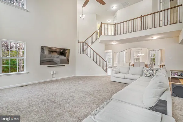 view of living room with furniture and a fireplace