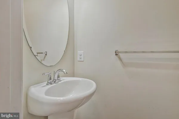 a bedroom with a bed and large window