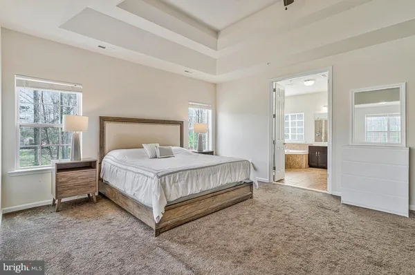a bath tub sitting next to a shower
