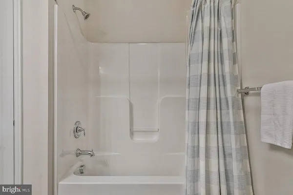 a view of living room filled with furniture and staircase