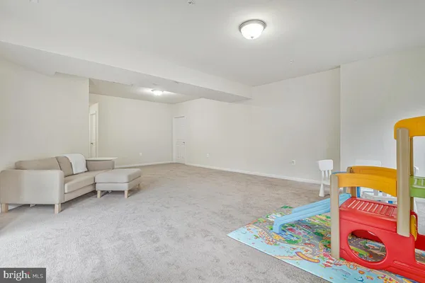 a view of backyard of house with outdoor seating