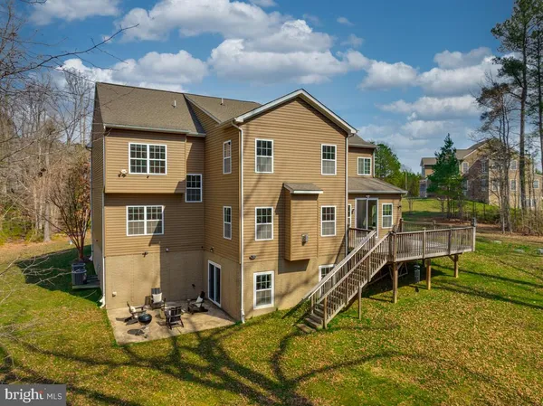 an aerial view of a house with a swimming pool
