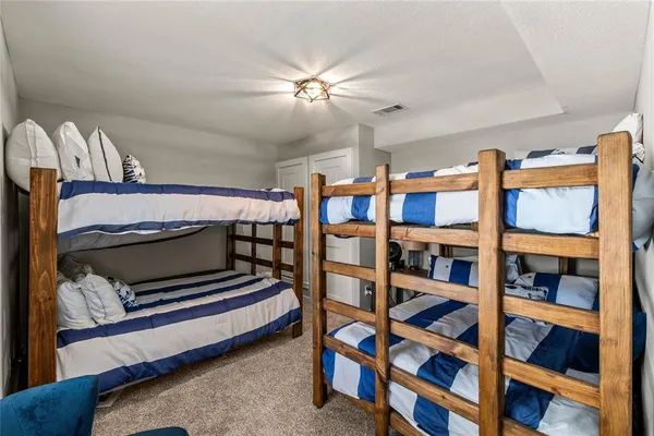 a living room with furniture a ceiling fan and a rug