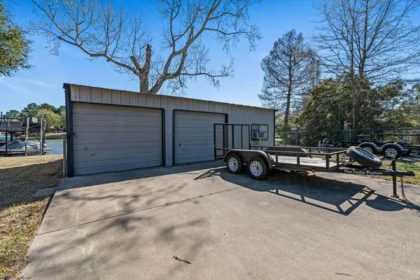 a view of backyard with seating area and trees