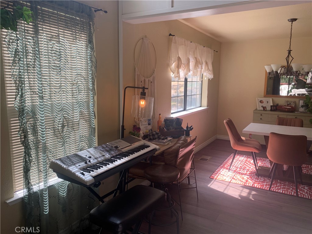 40513 Saddleback Road Bass Lake, CA 93604 - Photo 11 of 11 a view of a dining room with furniture and chandelier