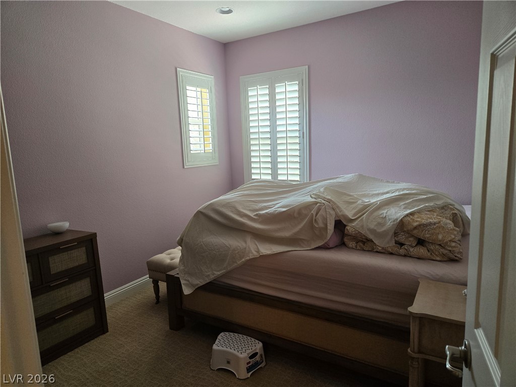 3144 Whitfeild Avenue Henderson, NV 89044 - Photo 50 of 55 Plantation shutters adorn windows in this well-lit bedroom.