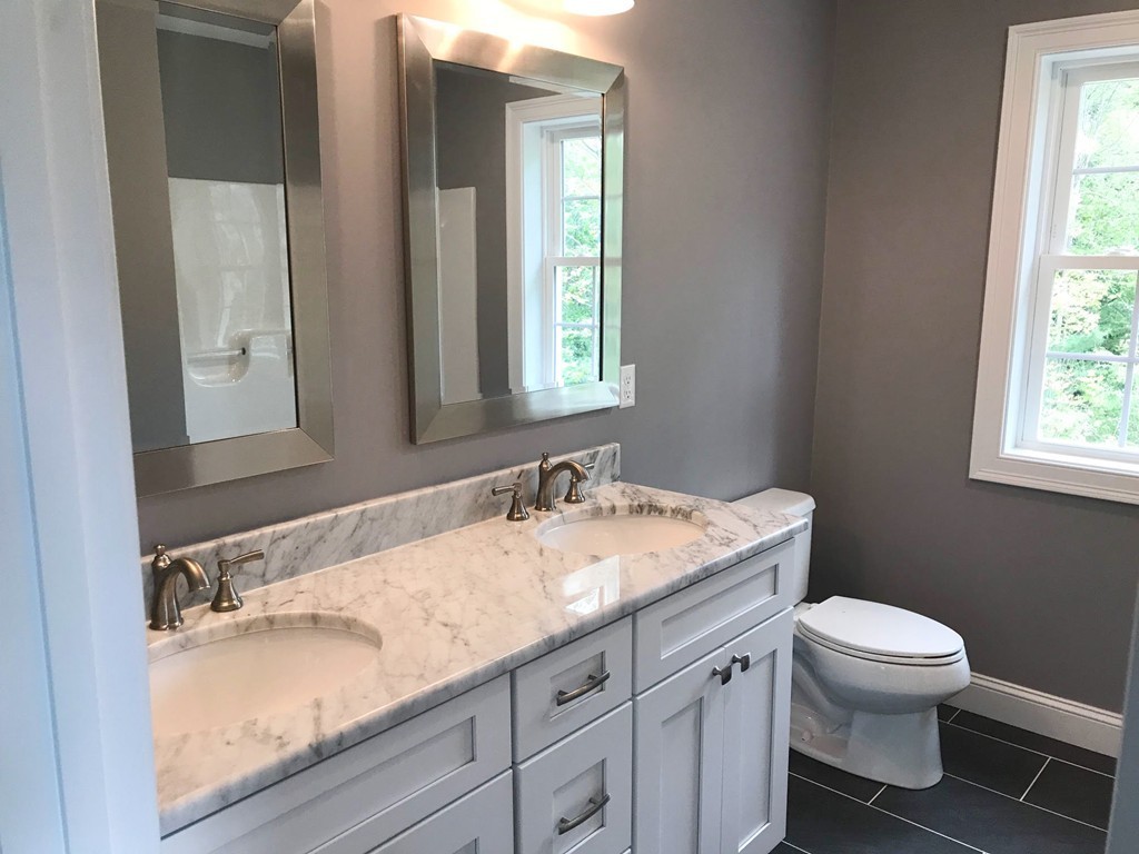 15 Minott Road Westminster, MA 01473 - Photo 11 of 26 a bathroom with a granite countertop sink toilet and mirror