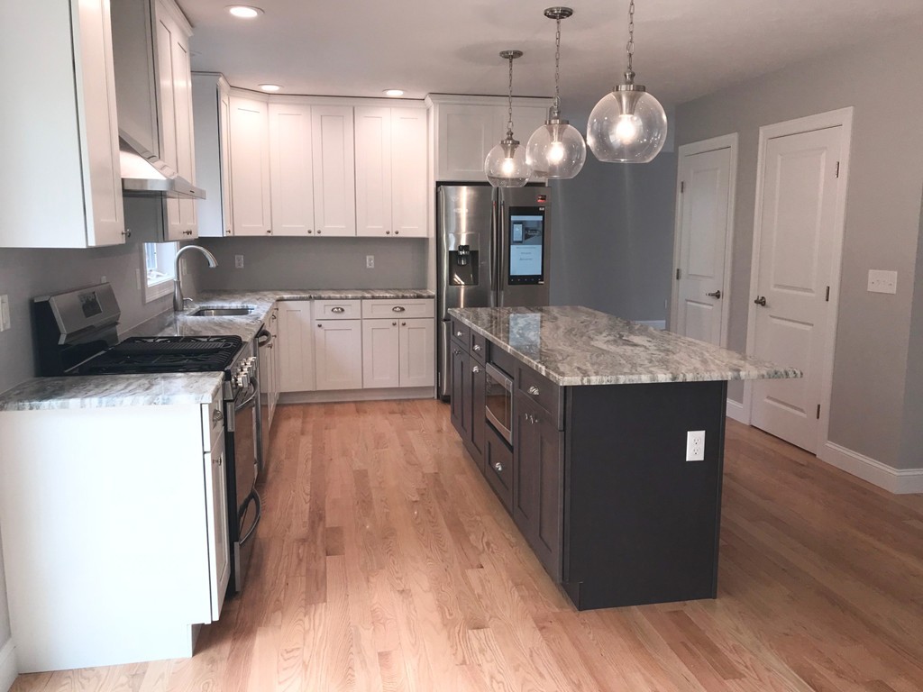 15 Minott Road Westminster, MA 01473 - Photo 3 of 26 a kitchen with stainless steel appliances granite countertop wooden cabinets a stove a sink a refrigerator and a wooden floors