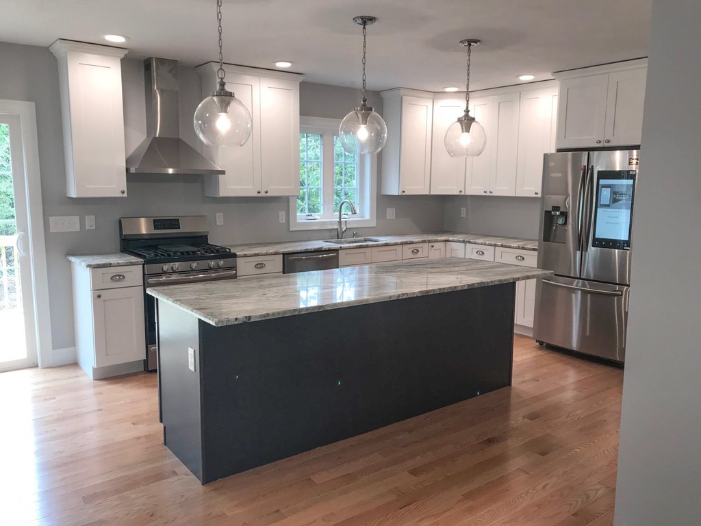 15 Minott Road Westminster, MA 01473 - Photo 4 of 26 a kitchen with stainless steel appliances granite countertop a sink a stove a refrigerator and island with wooden floor