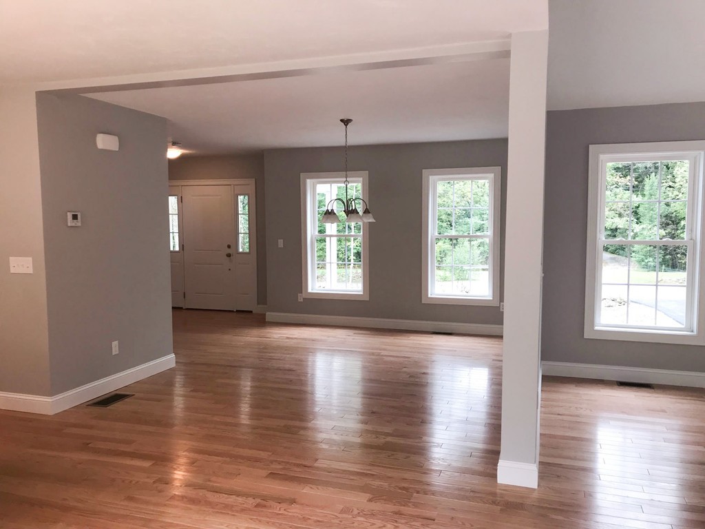 15 Minott Road Westminster, MA 01473 - Photo 5 of 26 a view of an empty room with wooden floor and a window