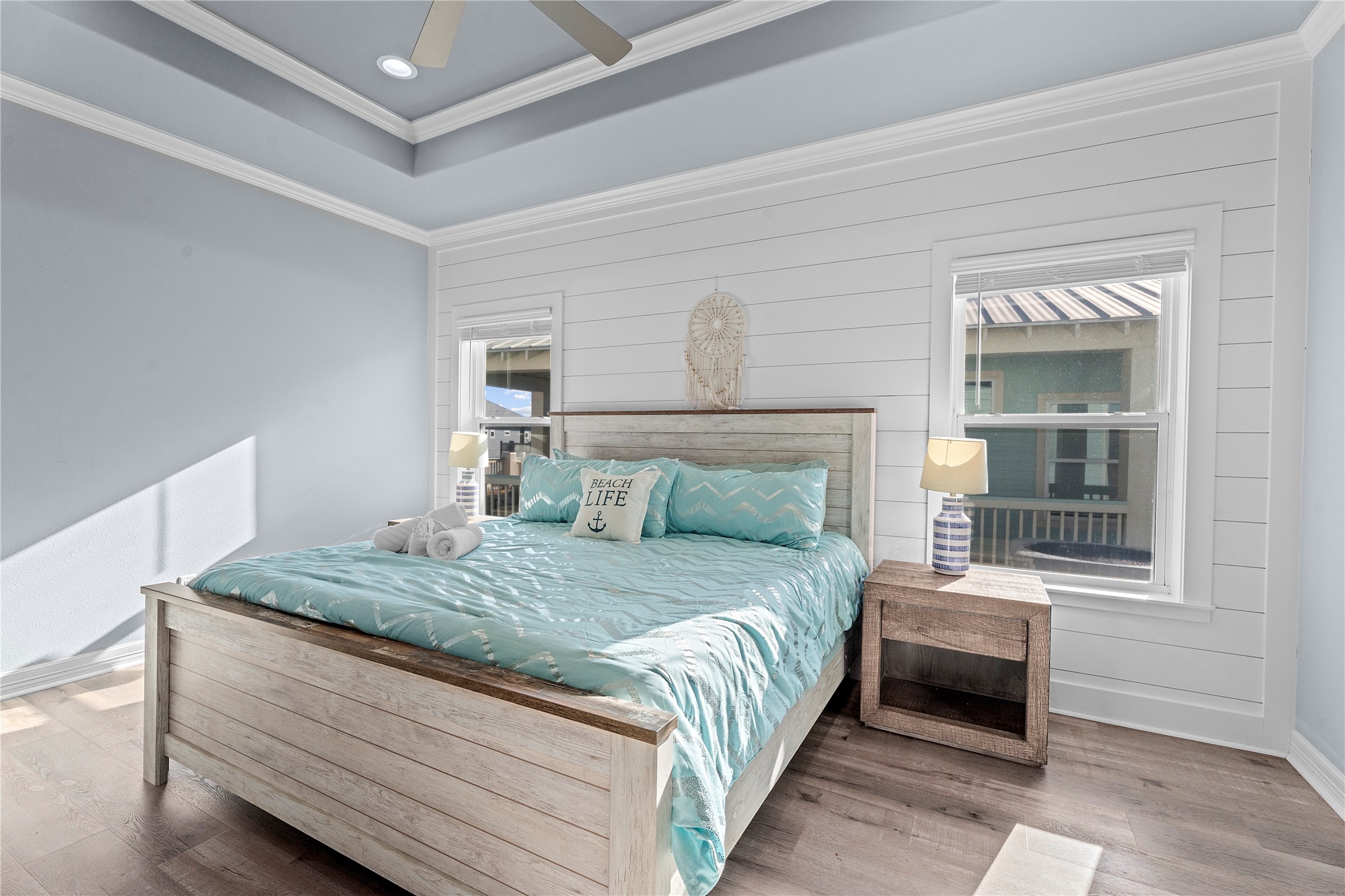 941 South Gateway Road Crystal Beach, TX 77650 - Photo 13 of 43 a bedroom with a bed and a window