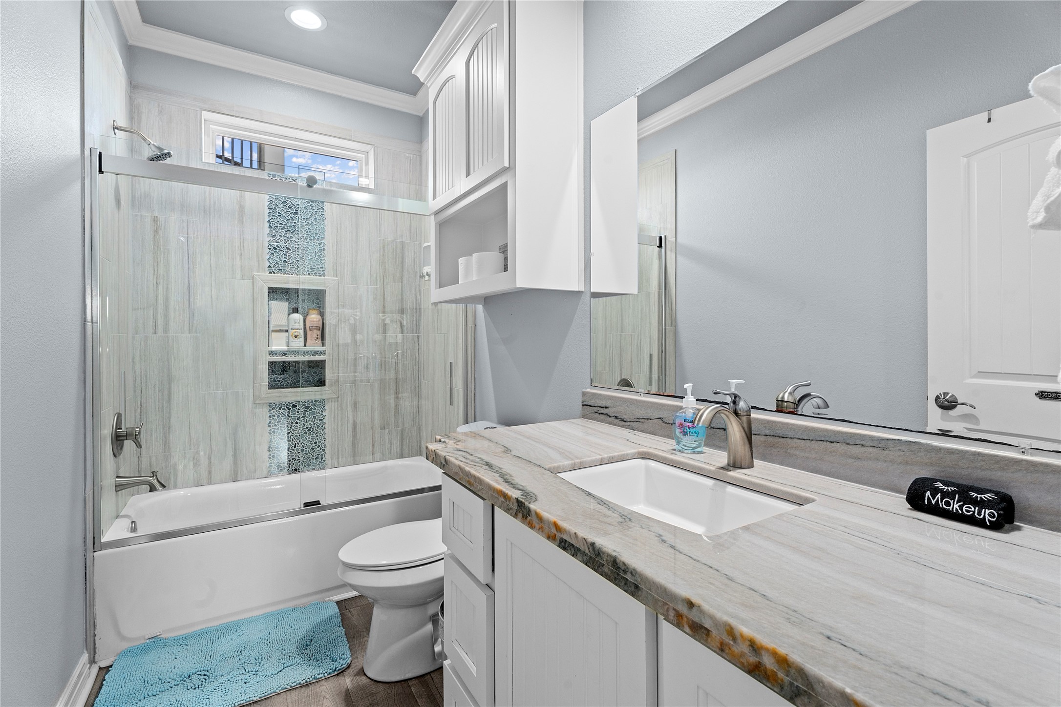 941 South Gateway Road Crystal Beach, TX 77650 - Photo 15 of 43 a bathroom with a sink a toilet and shower