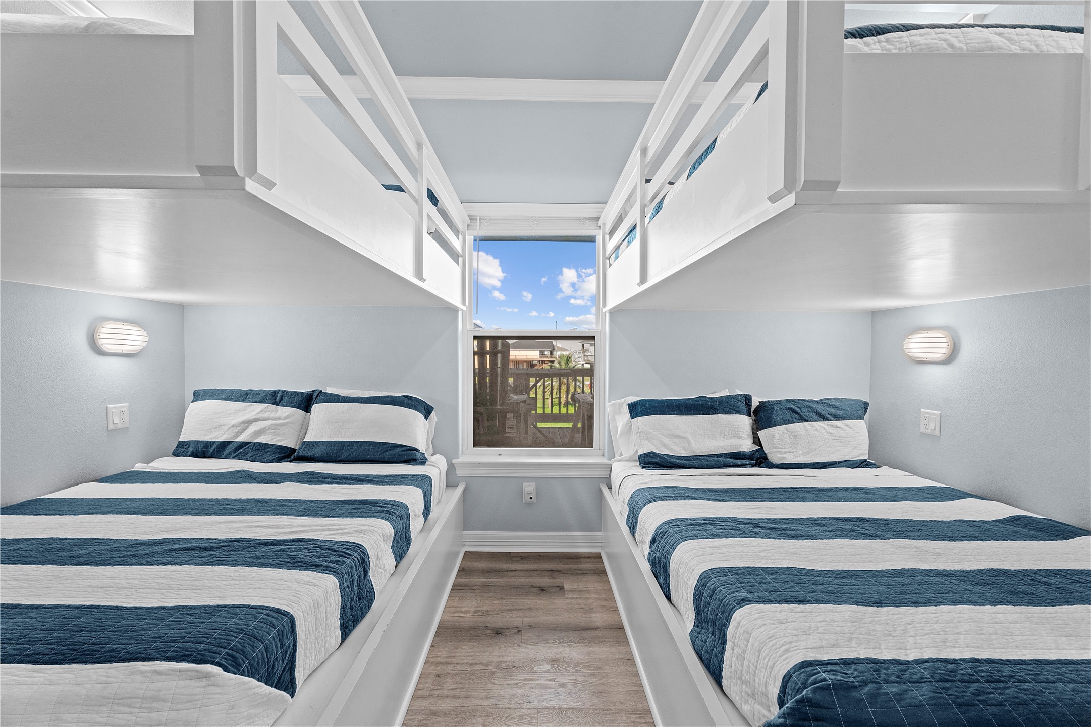 941 South Gateway Road Crystal Beach, TX 77650 - Photo 17 of 43 a bedroom with double bed and a window