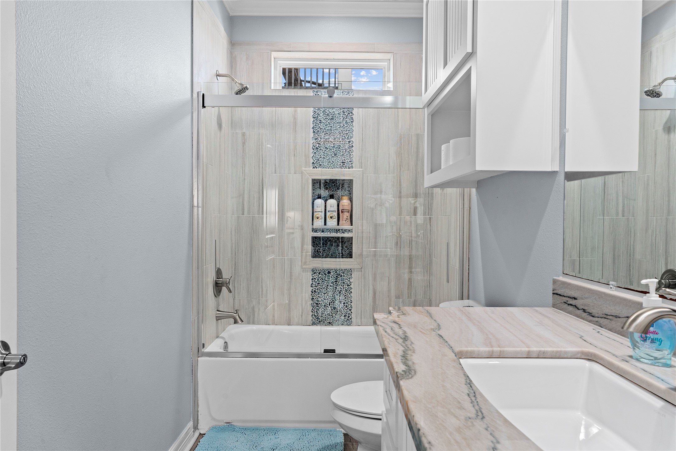 941 South Gateway Road Crystal Beach, TX 77650 - Photo 18 of 43 a bathroom with a sink toilet and shower