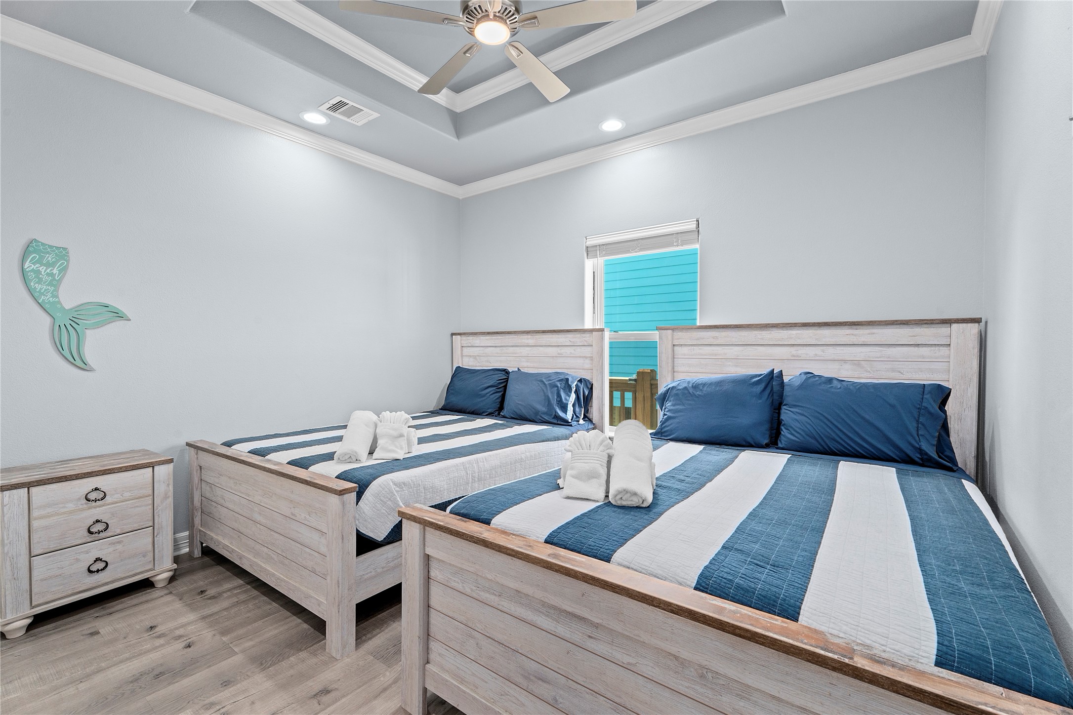 941 South Gateway Road Crystal Beach, TX 77650 - Photo 20 of 43 a bedroom with a bed and window