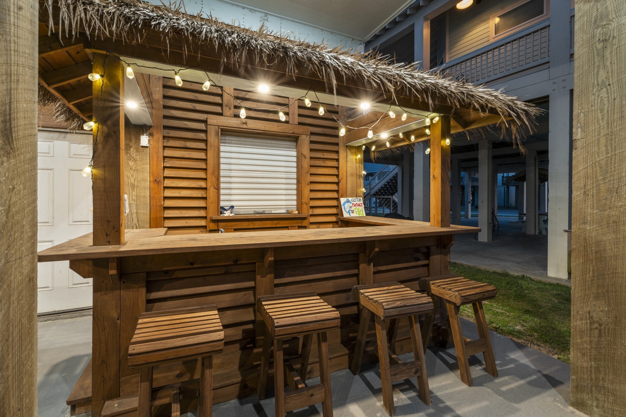 941 South Gateway Road Crystal Beach, TX 77650 - Photo 2 of 43 a porch with a table and chairs in it