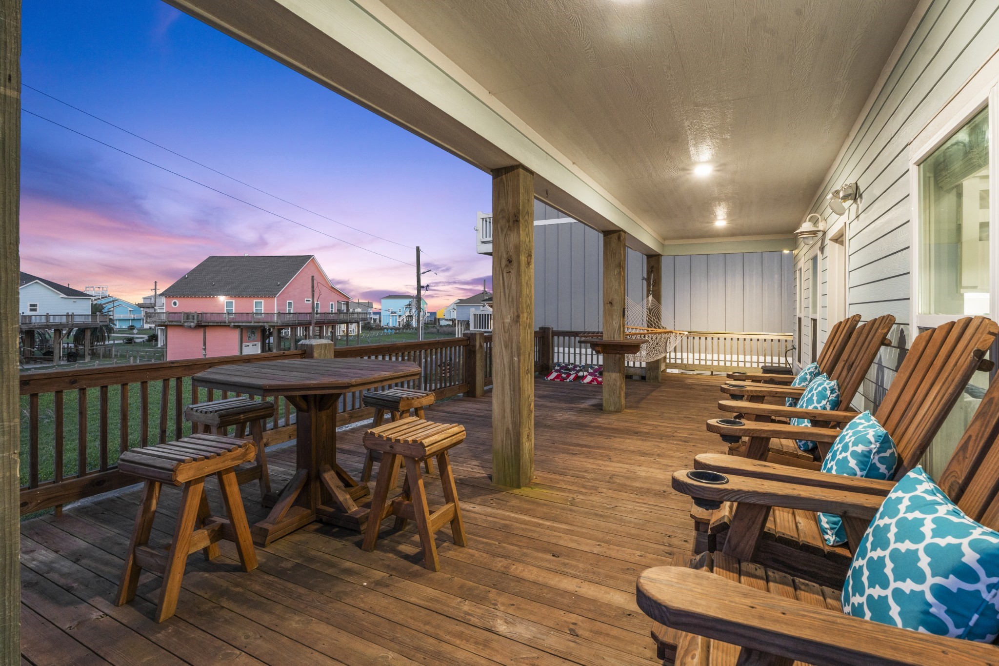 941 South Gateway Road Crystal Beach, TX 77650 - Photo 23 of 43 a view of a chairs and table on the deck
