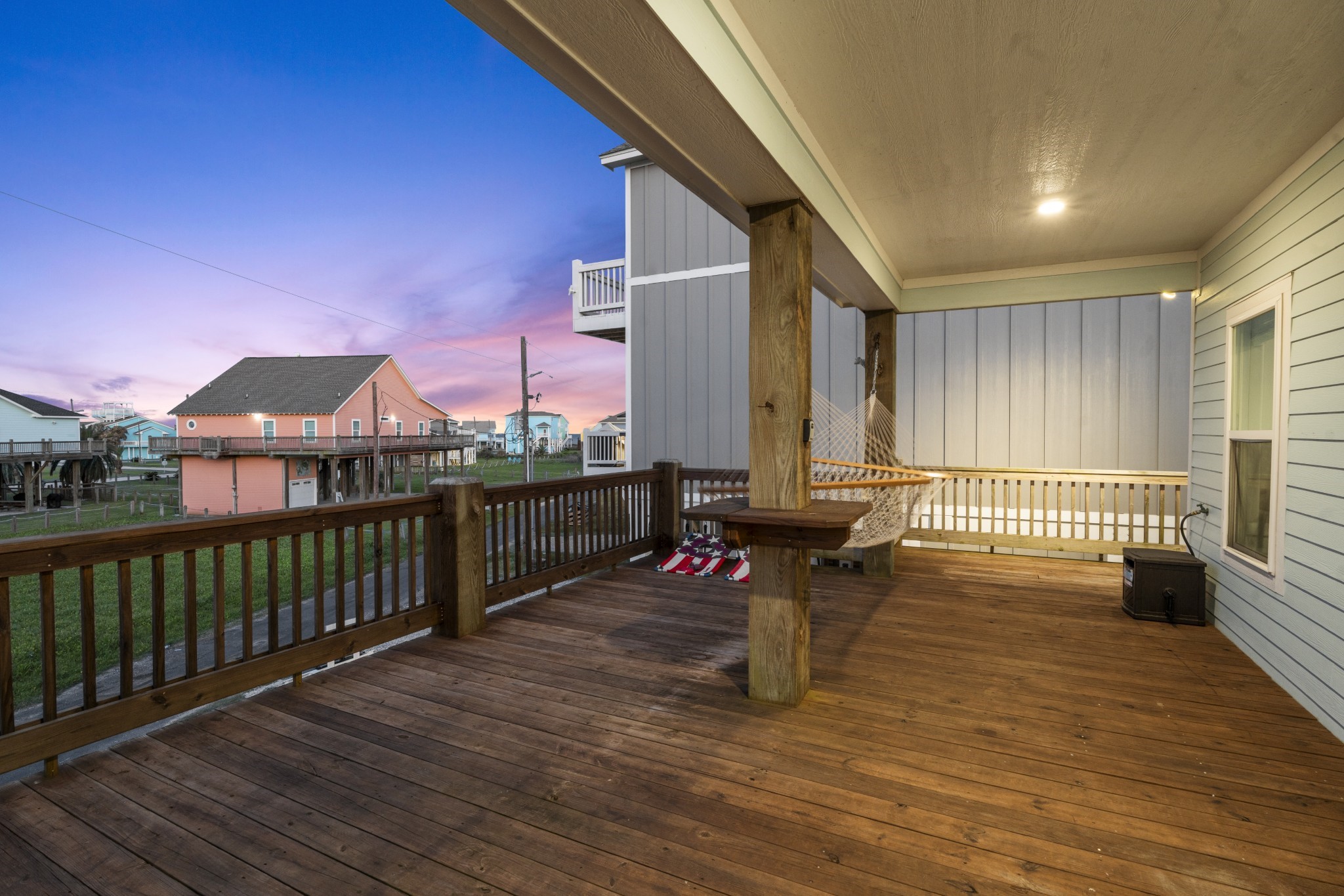 941 South Gateway Road Crystal Beach, TX 77650 - Photo 25 of 43 a view of balcony with wooden floor