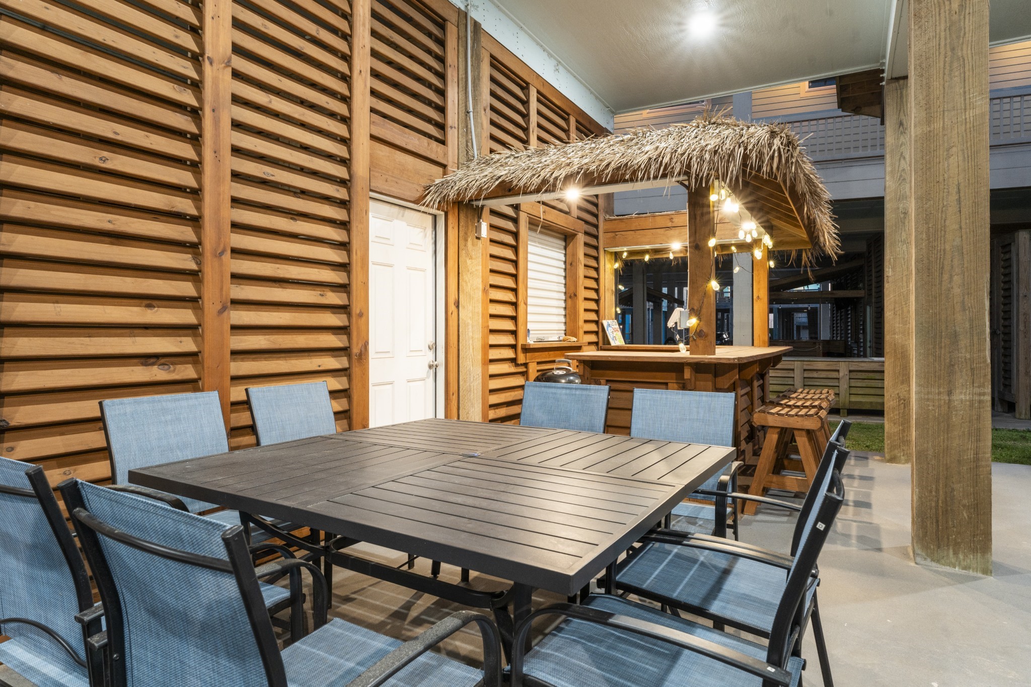 941 South Gateway Road Crystal Beach, TX 77650 - Photo 39 of 43 a view of a patio with a table and chairs
