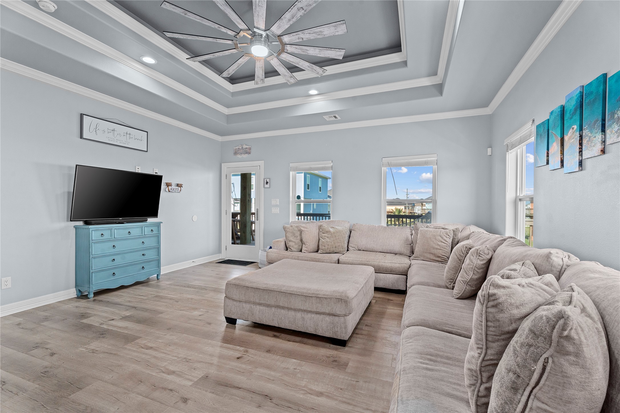 941 South Gateway Road Crystal Beach, TX 77650 - Photo 4 of 43 a living room with furniture and a flat screen tv