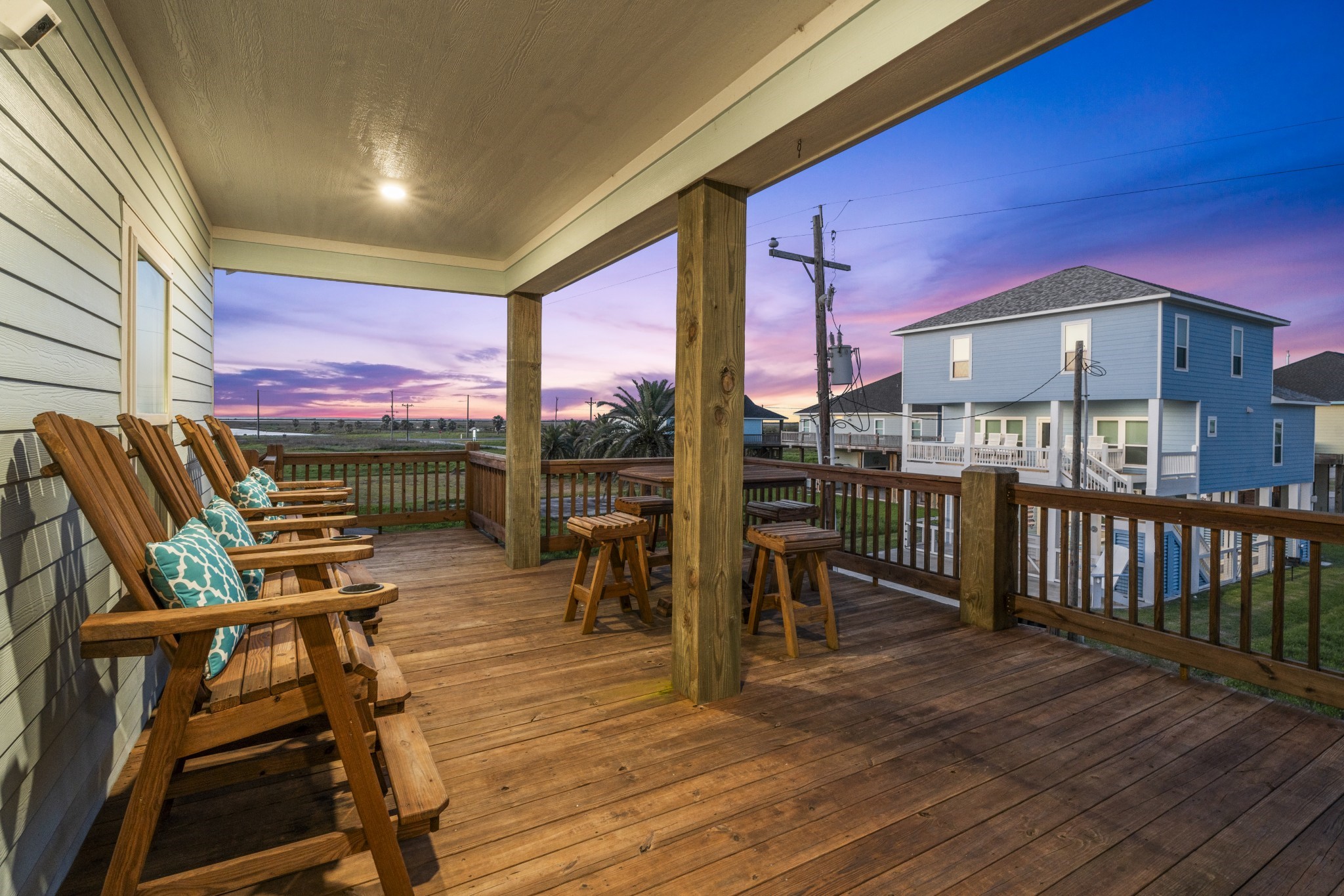 941 South Gateway Road Crystal Beach, TX 77650 - Photo 5 of 43 a view of a chairs and table in patio