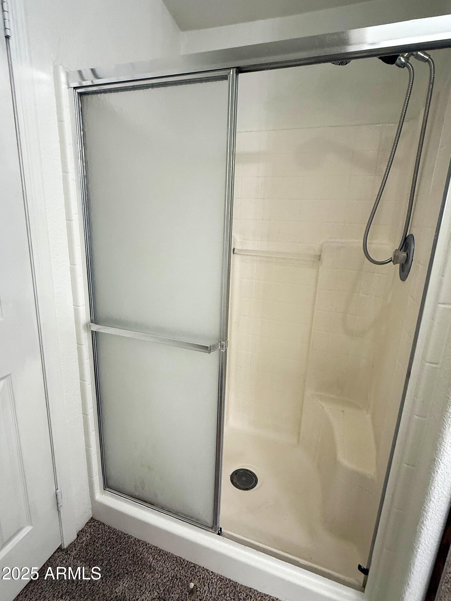 7672 Mesa Vista Payson, AZ 85541 - Photo 12 of 24 a bathroom with a glass shower door