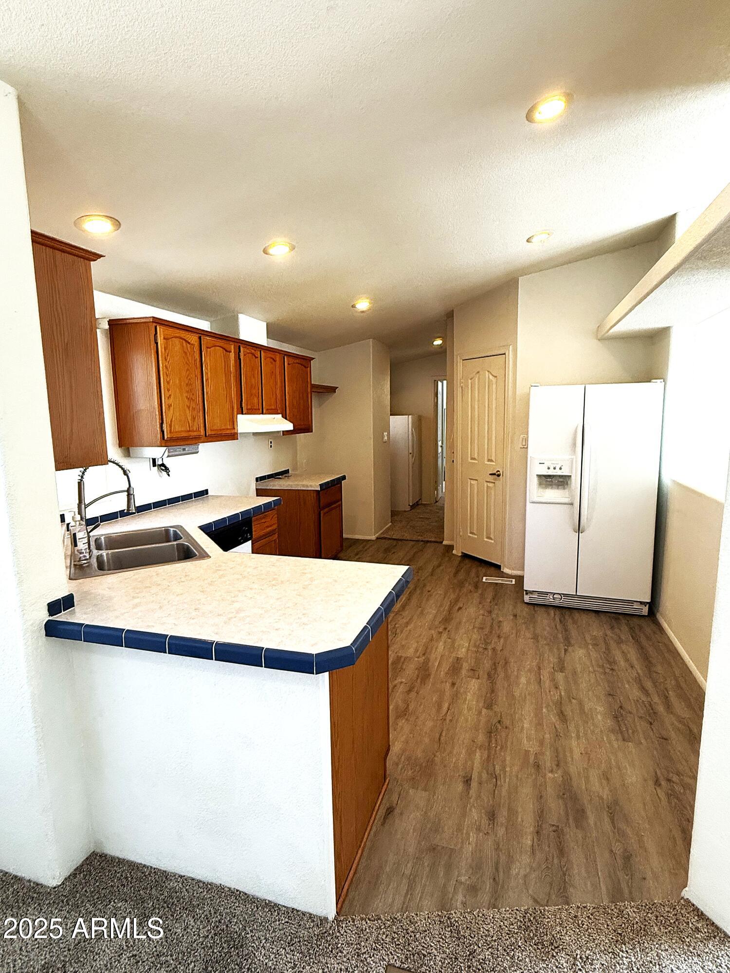 7672 Mesa Vista Payson, AZ 85541 - Photo 16 of 24 a kitchen with stainless steel appliances granite countertop a sink refrigerator and microwave