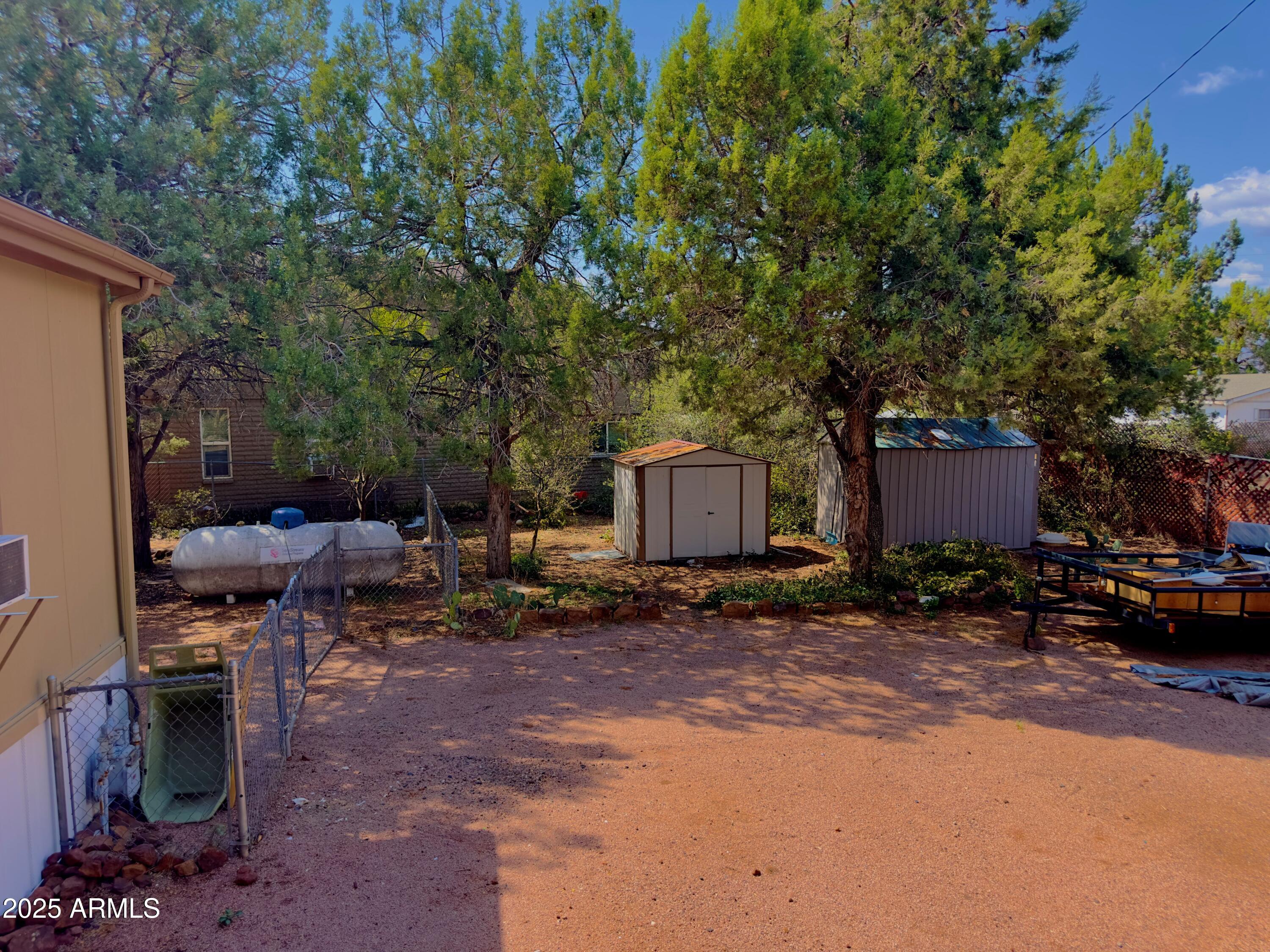 7672 Mesa Vista Payson, AZ 85541 - Photo 19 of 24 a backyard of a house with barbeque oven and outdoor seating