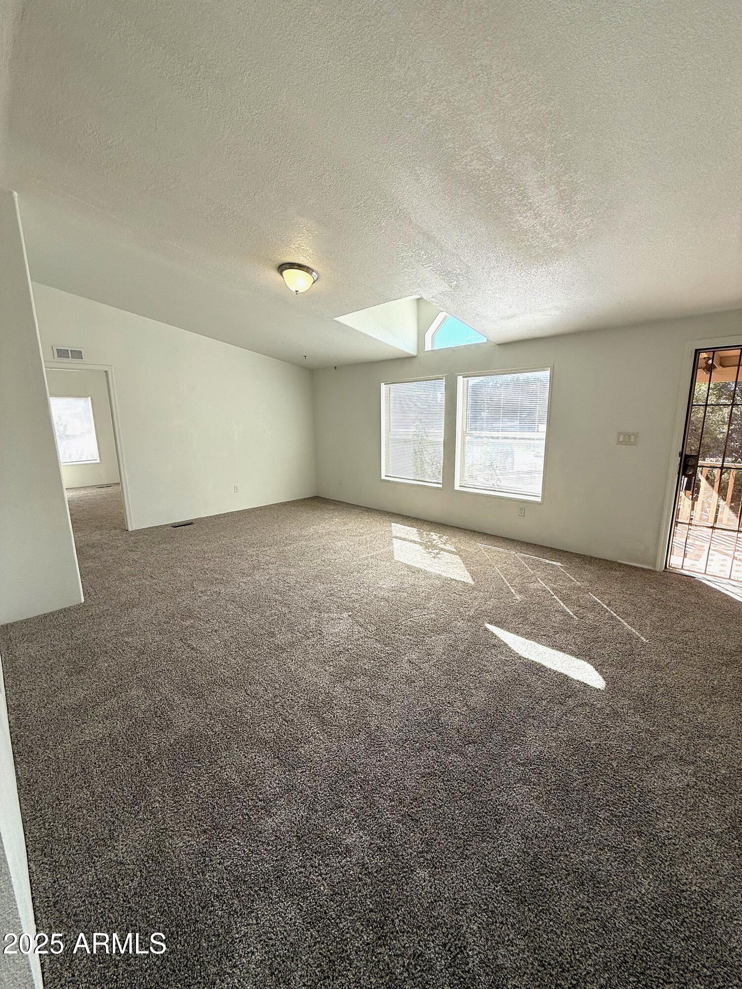 7672 Mesa Vista Payson, AZ 85541 - Photo 4 of 24 an empty room with windows and closet