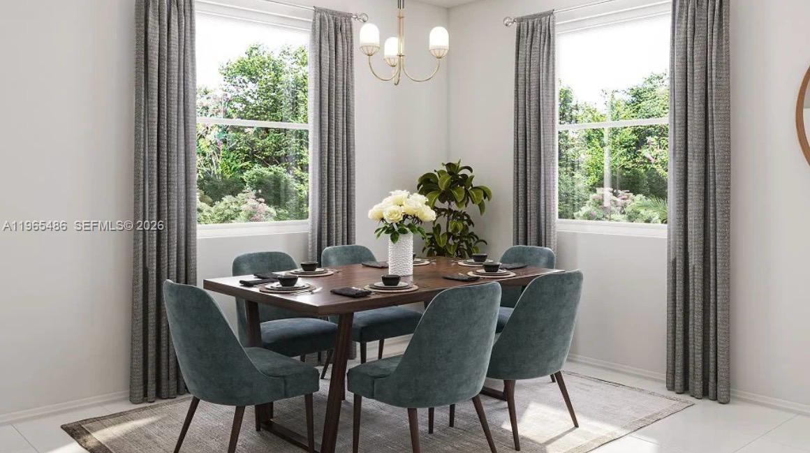12470 Southwest 248th Street, Unit 1 Homestead, FL 33032 - Photo 14 of 35 a dining room with furniture and window