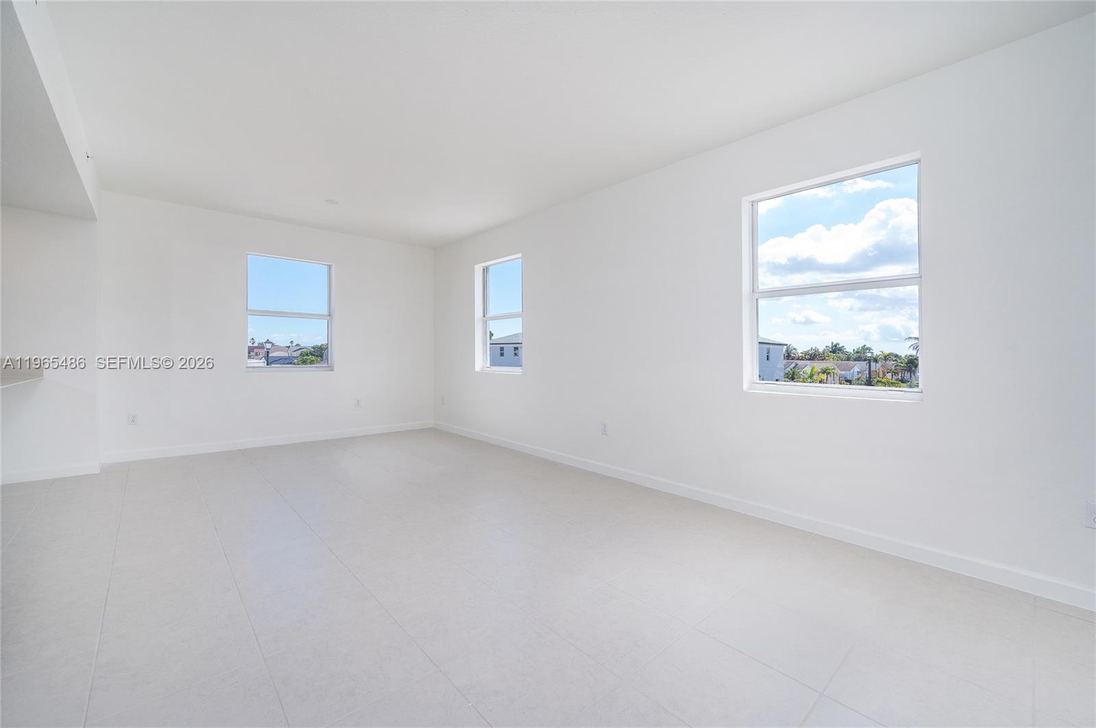 12470 Southwest 248th Street, Unit 1 Homestead, FL 33032 - Photo 16 of 35 an empty room with windows