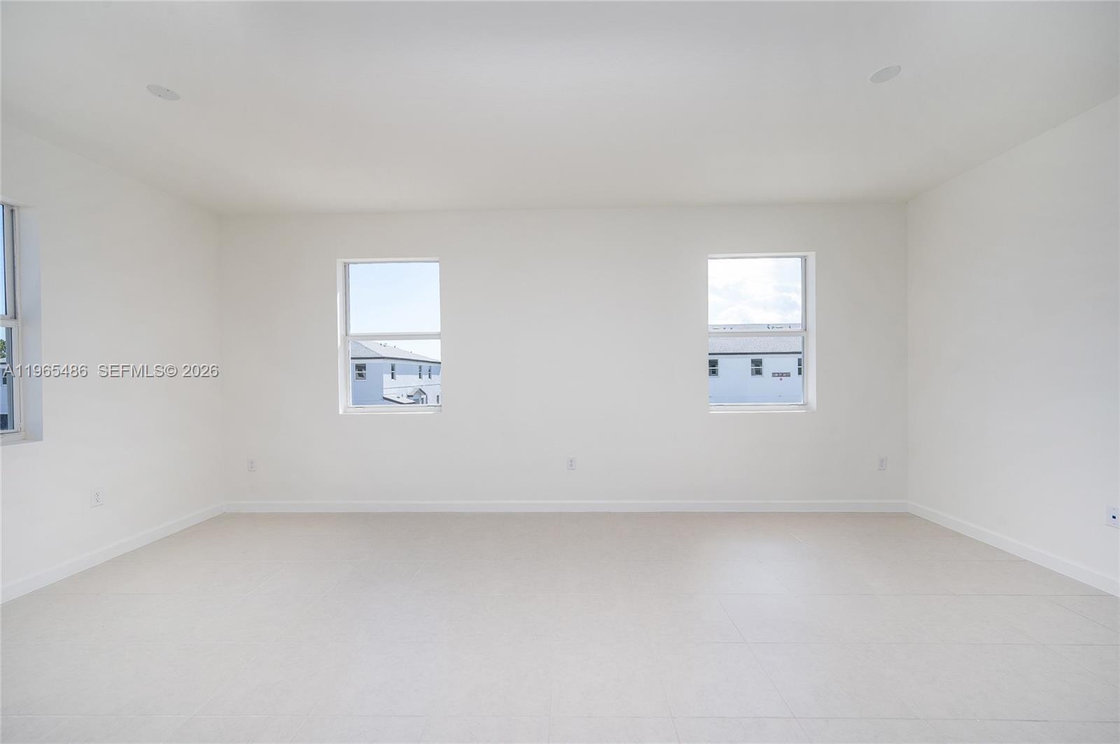 12470 Southwest 248th Street, Unit 1 Homestead, FL 33032 - Photo 17 of 35 an empty room with a window