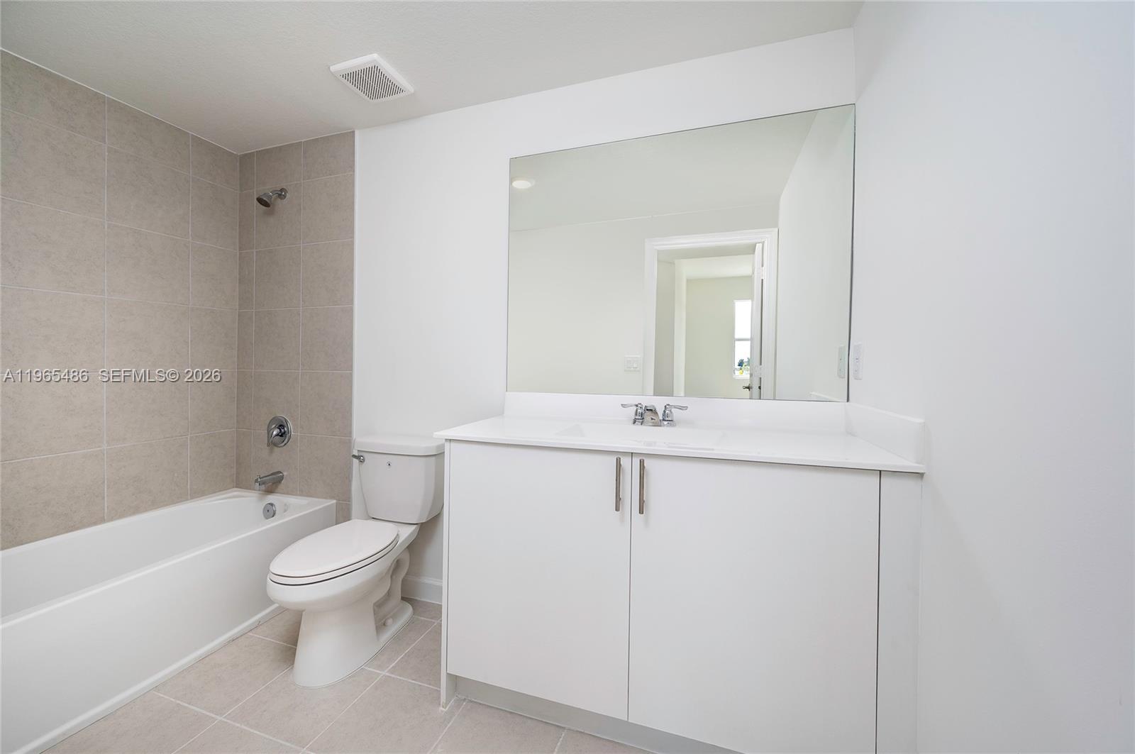 12470 Southwest 248th Street, Unit 1 Homestead, FL 33032 - Photo 20 of 35 a bathroom with a sink a toilet and shower