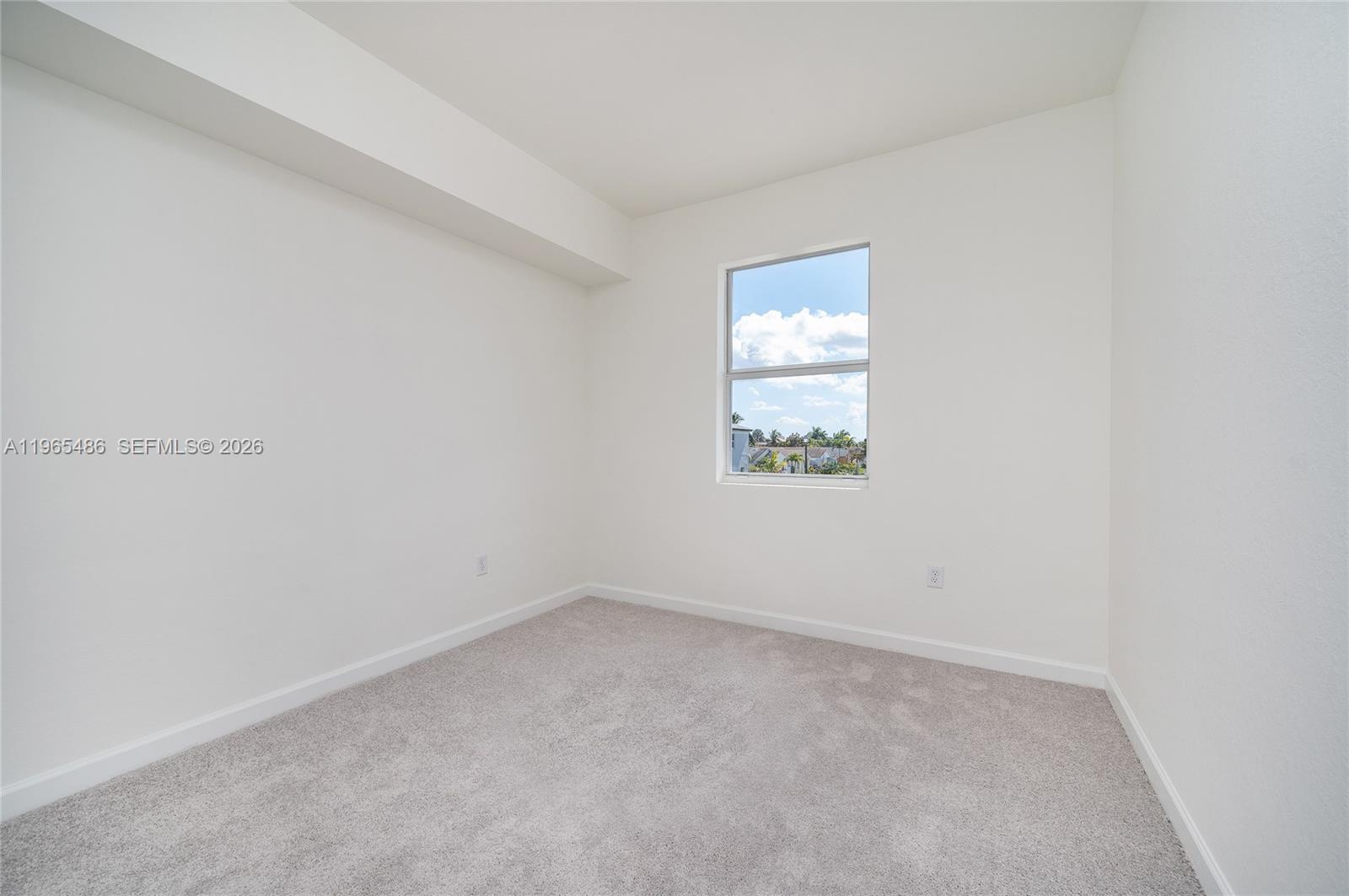 12470 Southwest 248th Street, Unit 1 Homestead, FL 33032 - Photo 24 of 35 an empty room with a window