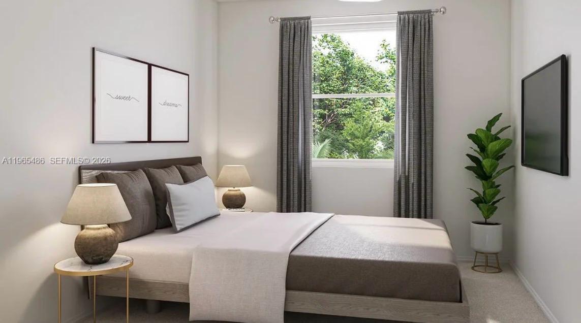 12470 Southwest 248th Street, Unit 1 Homestead, FL 33032 - Photo 26 of 35 a bedroom with a bed and a window