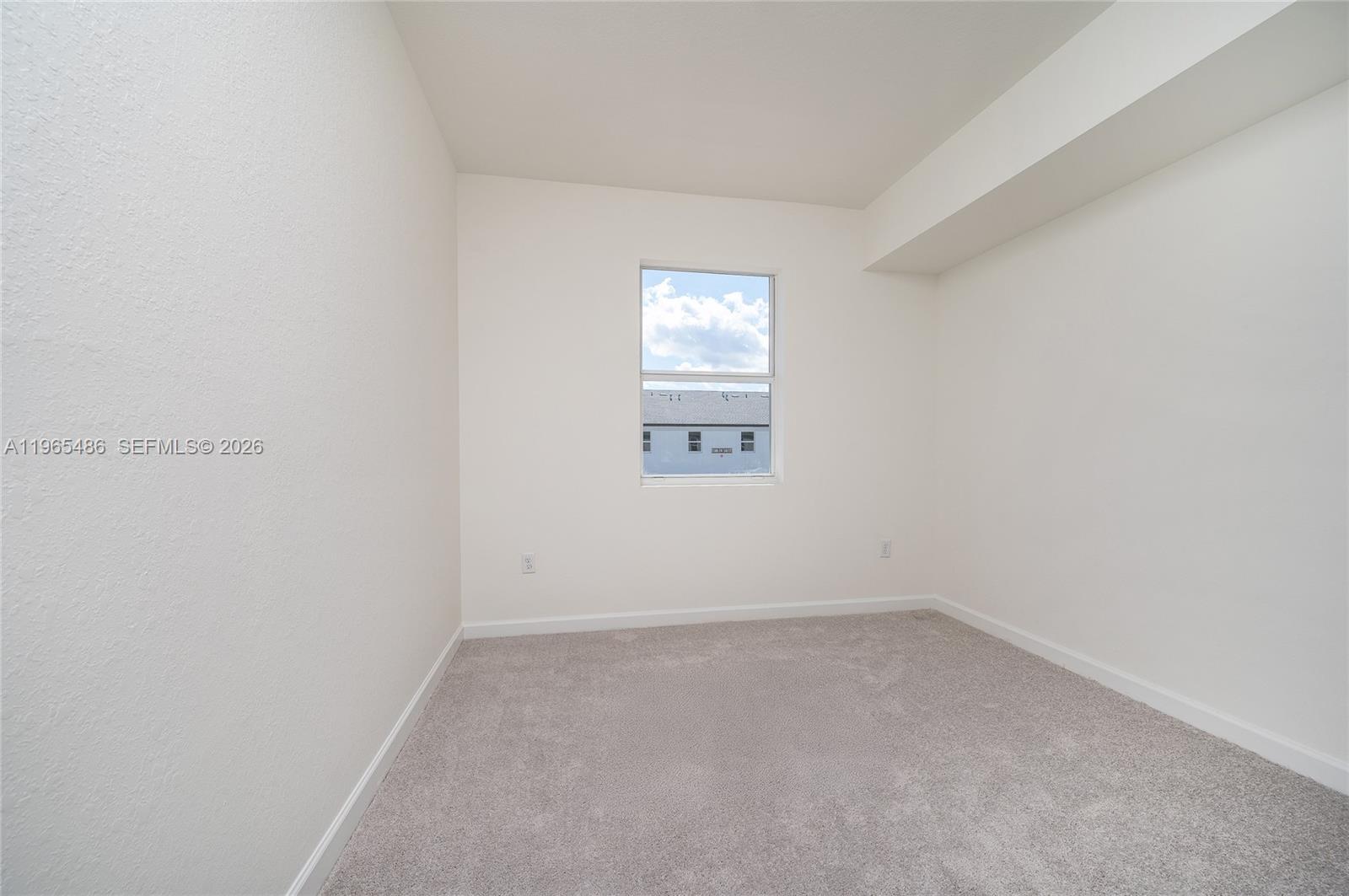 12470 Southwest 248th Street, Unit 1 Homestead, FL 33032 - Photo 28 of 35 a view of an empty room and a window