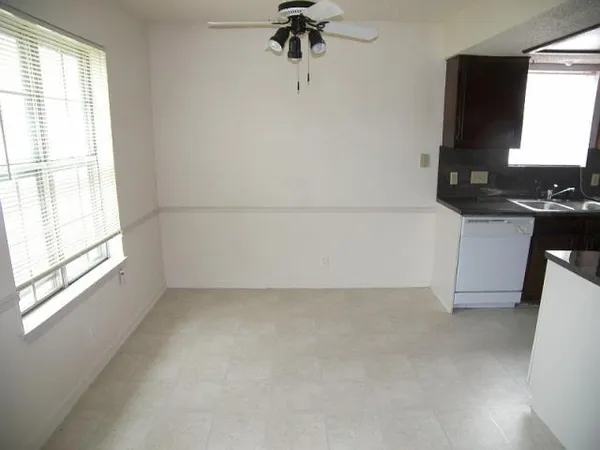 a kitchen with a sink and a window